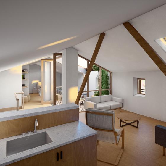 Vue intérieure de la chambre de l'étage où la charpente existante est conservée
