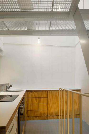 Cuisine ouverte réalisée sur mesure en Rolpin Bâti.