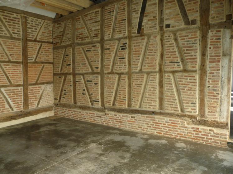 mur existant briques rénovés sol béton ciré