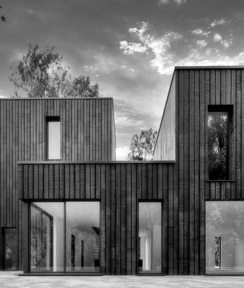 Maison contemporaine à ossature bois - Façade en bois brulé