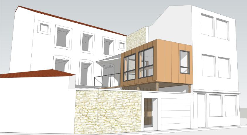 Le bureau est construit au dessus du garage et s'appuie sur le mur de clôture en
