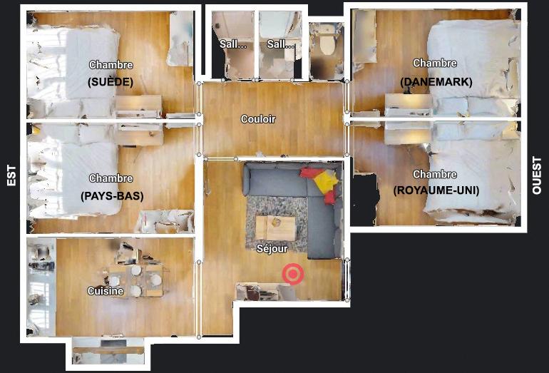 Plan d’un appartement réorganisé en colocation comprenant quatre chambres indépendantes, un séjour central, une cuisine séparée et des espaces sanitaires, avec circulation optimisée