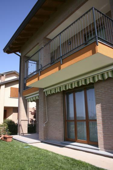Vue jardin Façade arrière et jardin, maison jumelée en brique apparente