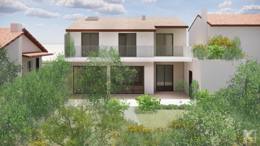 Perspective de la façade jardin d'une maison individuelle contemporaine à Villeurbanne, grandes baies vitrées au RDC, balcon filant à l'étage, terrasse et jardin paysager