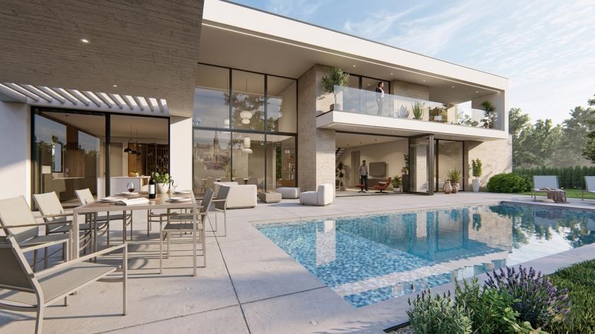 Vue arrière d’une maison contemporaine depuis le poolhouse avec piscine et grandes baies vitrées à Marly en Moselle