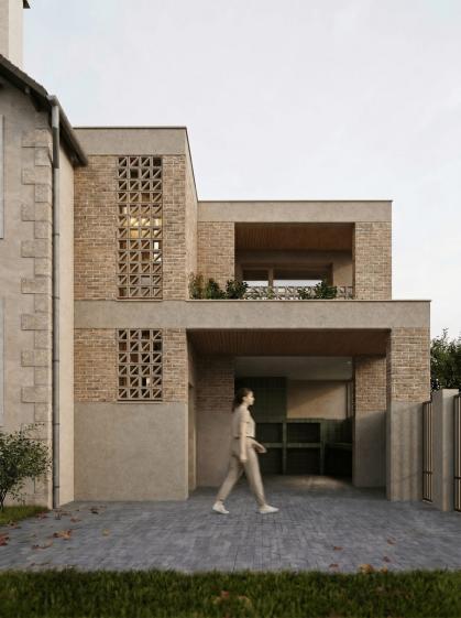 Extension contemporaine d'une maison individuelle dans le Val-de-Marne, façade en brique de terre cuite