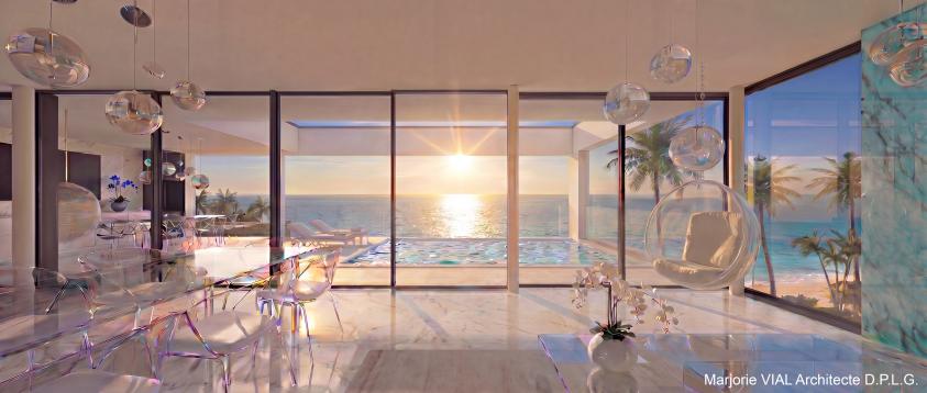 Maison contemporaine haut de gamme face à la mer. Grande terrasse couverte et piscine à débordement, garde corps en verre. Baie vitrée du sol au plafond sur toute la façade du séjour. Sol en marbre blanc et quelques murs en marbre bleu d'Espagne.