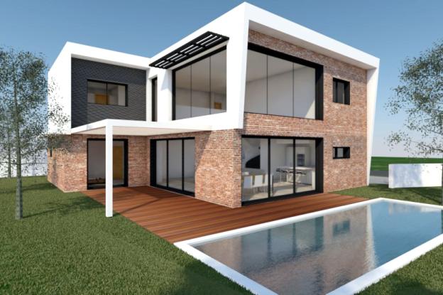 Construction d'une maison contemporaine par l'atelier S , architecte basé à Toulouse : vue de la façade principale avec la piscine au premier plan