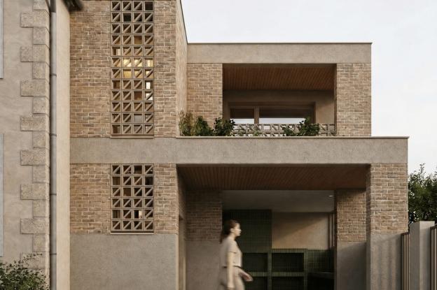 Extension contemporaine d'une maison individuelle dans le Val-de-Marne, façade en brique de terre cuite