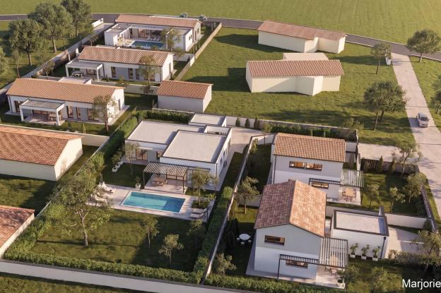 Construction d'un lotissement de 6 maisons individuelles d'une surface plancher totale de 704 m², composé de 4 maisons T5 de plain-pied et de 2 maisons T4 à étage.