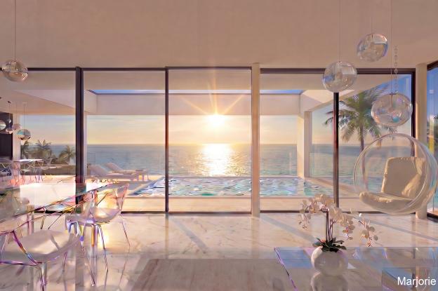 Maison contemporaine haut de gamme face à la mer. Grande terrasse couverte et piscine à débordement, garde corps en verre. Baie vitrée du sol au plafond sur toute la façade du séjour. Sol en marbre blanc et quelques murs en marbre bleu d'Espagne.